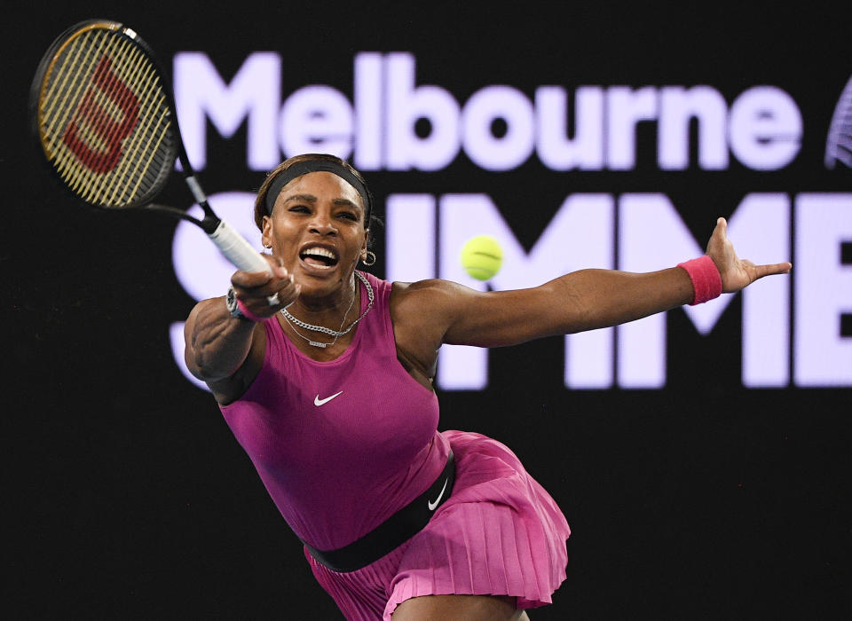 FILE - United States' Serena Williams makes a forehand return to compatriot Danielle Collins during a tuneup event ahead of the Australian Open tennis championships in Melbourne, Australia, Friday, Feb. 5, 2021. (AP Photo/Andy Brownbill, File)