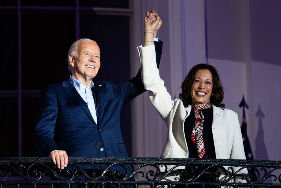 US President Joe Biden, left, and Vice President Kamala Harris on the Truman Balcony of the White House in Washington, DC, US, on Thursday, July 4, 2024. Biden's reelection campaign limped into the US Independence Day holiday, exhausted by a week of the incumbent clawing to maintain his hold on his party's nomination. 