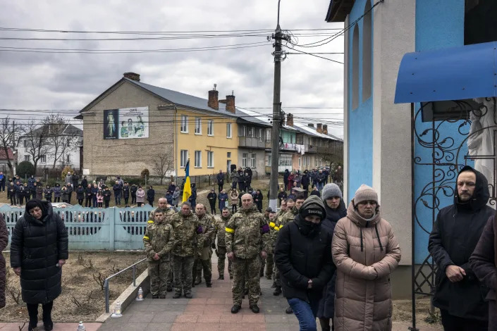 A funeral near Lviv, Ukraine, on Sunday, March 6, 2022, for a member of the Ukrainian Army who died while fighting Russian forces. (Ivor Prickett/The New York Times)