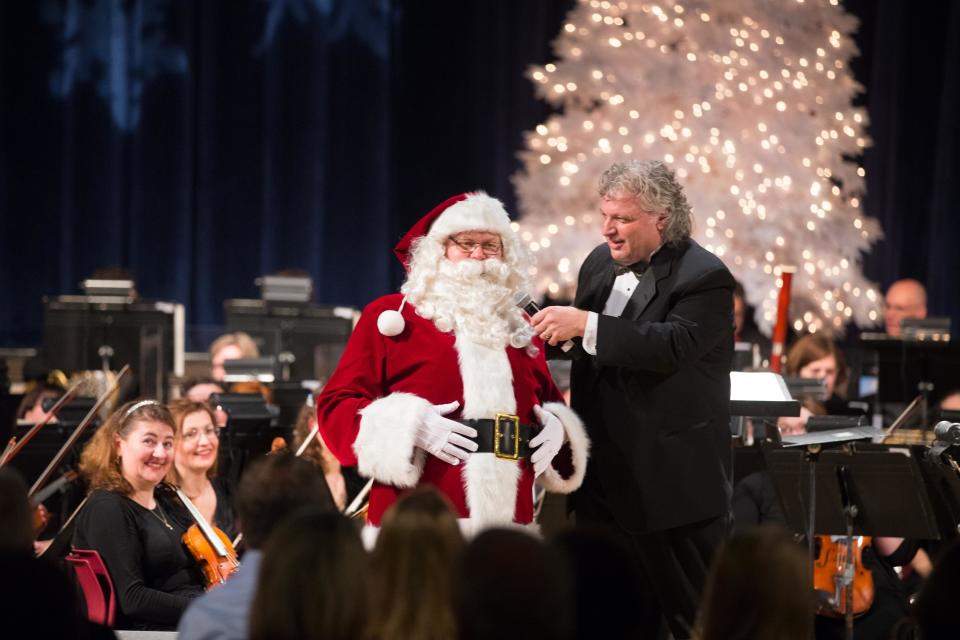 Conductor Steven Karidoyanes has a chat with Santa during the Plymouth Philharmonic Holiday Pops concert in 2019.