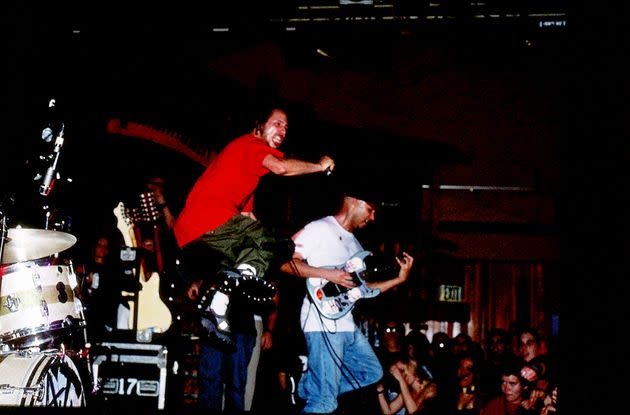 Vocalist Zack de la Rocha jumps high from the stage as he performs with guitarist Tom Morello, bassist Tim Commerford, and drummer Brad Wilk in Rage Against the Machine on Jan. 23, 1999, at The Troubadour in West Hollywood. (Photo: Lindsay Brice/Getty Images)