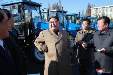 North Korean leader Kim Jong Un gives field guidance to the Kumsong Tractor Factory in this undated picture provided by KCNA in Pyongyang on November 15, 2017. KCNA via Reuters