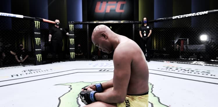 Anderson Silva kneels in Octagon at UFC Vegas 12