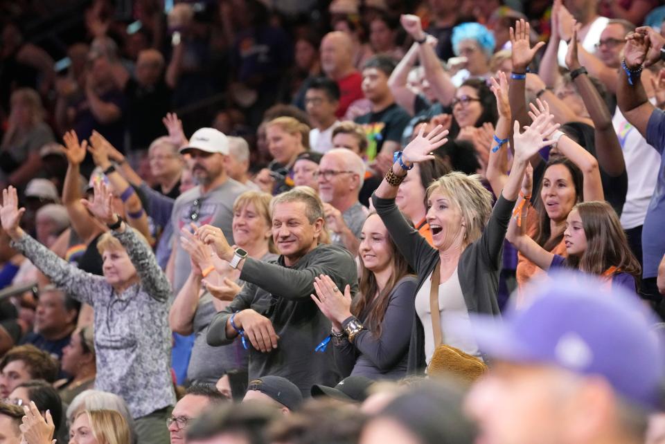 Fans stand for free tee shirts during the fourth quarter of the game between the Phoenix Mercury and the Seattle Storm at Footprint Center in Phoenix. The game was the the team's annual Pride Month theme on Sunday, June 16, 2024.