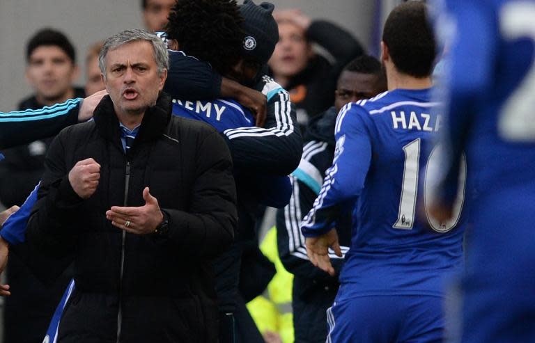 Chelsea's manager Jose Mourinho (L) reacts during their English Premier League match against Hull City, at the KC Stadium in Kingston upon Hull, north-east England, on March 22, 2015