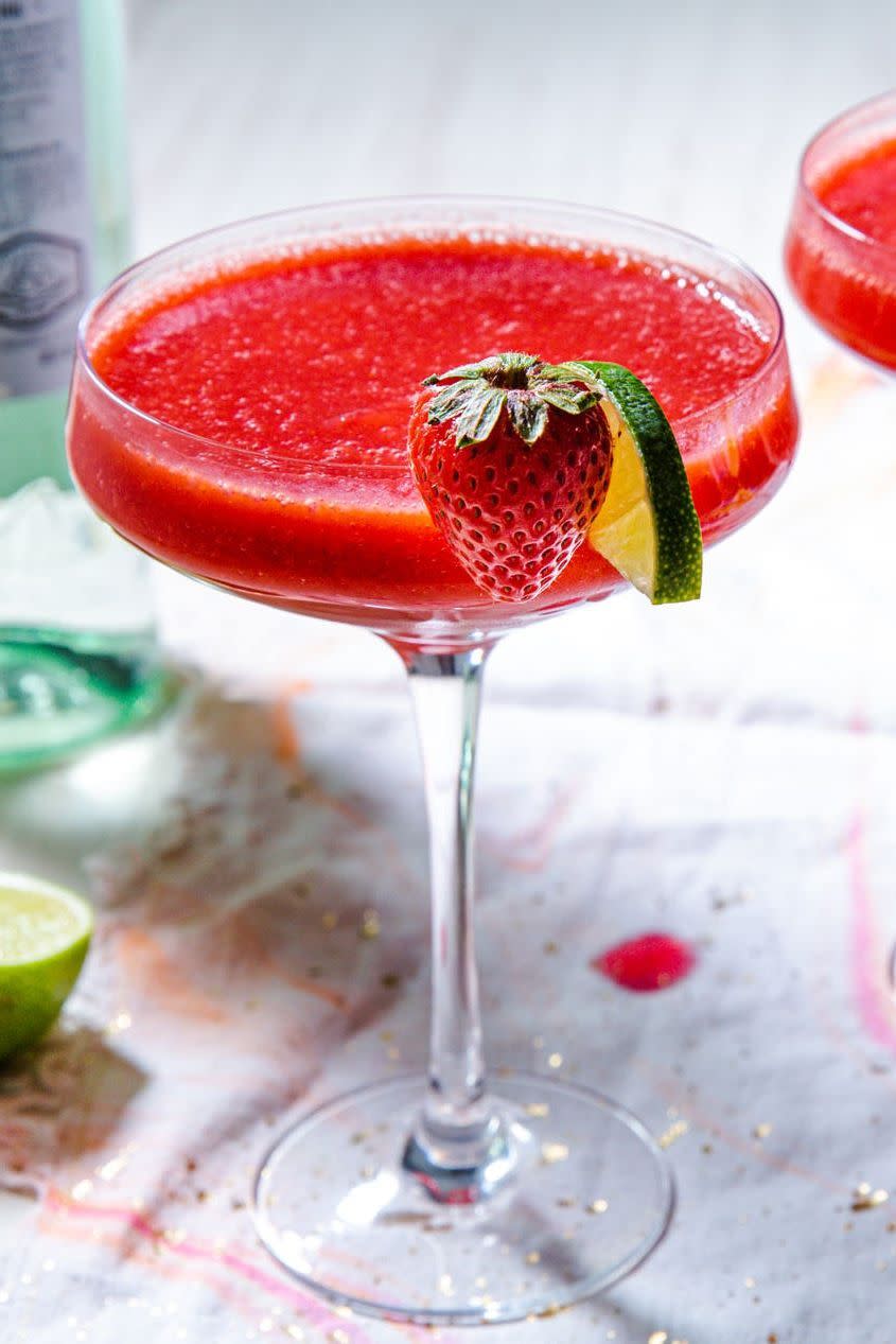 <p>Few things are as refreshing and delightful on a hot day as a frosty frozen daiquiri. Even diehard fans of <a href="https://www.delish.com/cooking/recipe-ideas/recipes/a4262/pina-colada-drinks-cocktails/" rel="nofollow noopener" target="_blank" data-ylk="slk:piña colada;elm:context_link;itc:0;sec:content-canvas" class="link ">piña colada</a> will love sipping the intoxicating blend of juicy, red strawberries brightened with lime. For best results, we call for two types of strawberries: fresh and frozen. Using <a href="https://www.delish.com/cooking/recipe-ideas/a32435072/how-to-freeze-strawberries/" rel="nofollow noopener" target="_blank" data-ylk="slk:frozen strawberries;elm:context_link;itc:0;sec:content-canvas" class="link ">frozen strawberries</a> gives body to the drink without watering down the flavor like ice would.</p><p>Get the <strong><a href="https://www.delish.com/cooking/recipe-ideas/recipes/a4298/strawberry-daiquiri-frozen-drinks/" rel="nofollow noopener" target="_blank" data-ylk="slk:Strawberry Daiquiri recipe;elm:context_link;itc:0;sec:content-canvas" class="link ">Strawberry Daiquiri recipe</a></strong>.</p>