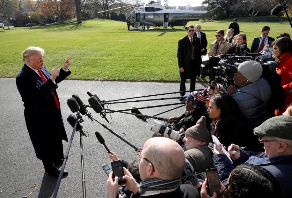 Donald Trump speaks to the press before departing for the G20 summit.