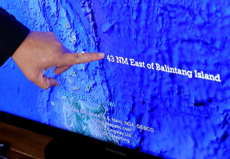 Asis Perez, Director of the Philippine Bureau of Fisheries and Aquatic Resources, points to a map on May 10, 2013 to show where the Philippine coastguard shot at a Taiwanese fishing vessel near Balintang island. Philippine coastguard spokesman Commander Armand Balilo said the incident took place in Philippine waters