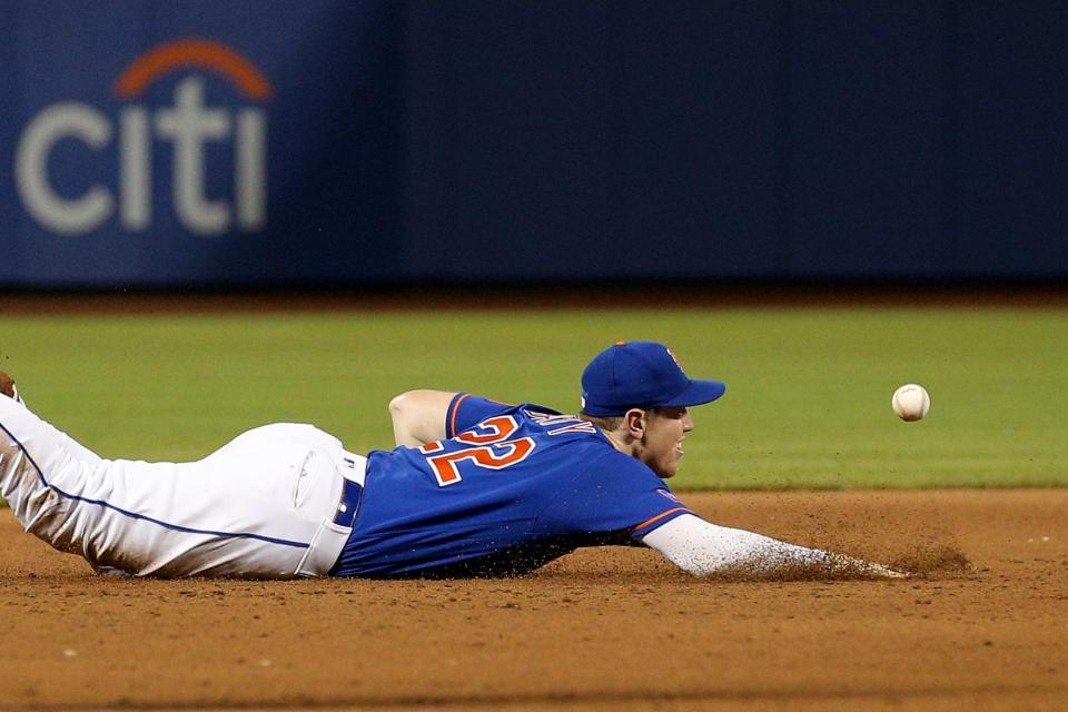 Jul 15, 2023; New York City, New York, USA; New York Mets third baseman Brett Baty (22) mis-plays a pop fly by Los Angeles Dodgers third baseman Max Muncy (not pictured) during the ninth inning on July 15, 2023, at Citi Field.