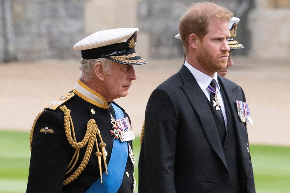 Britain's King Charles III (L) walks with his son Britain's Prince Harry, Duke of Sussex as they arrive at St George's Chapel inside Windsor Castle on September 19, 2022, ahead of the Committal Service for Britain's Queen Elizabeth II