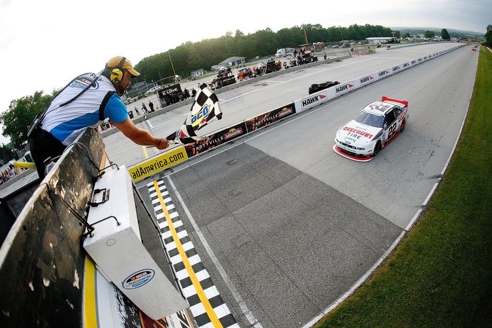 A.J. Allmendinger speeds to the checkered flag to win the 2013 Johnsonville Sausage 200.