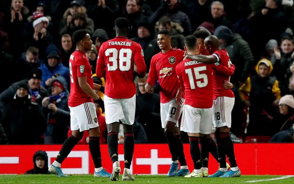 Marcus Rashford celebrates scoring his side's first goal  - PA