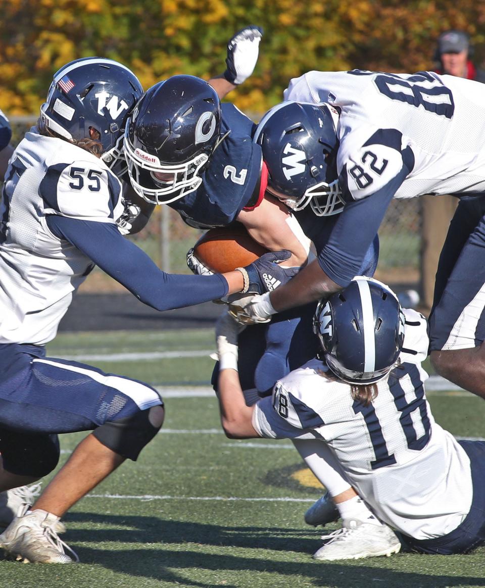 Cohasset running back Liam Appleton gets corralled by Nantucket's defensive line during the first game of the MIAA tournament on Friday, Nov. 5, 2021.
