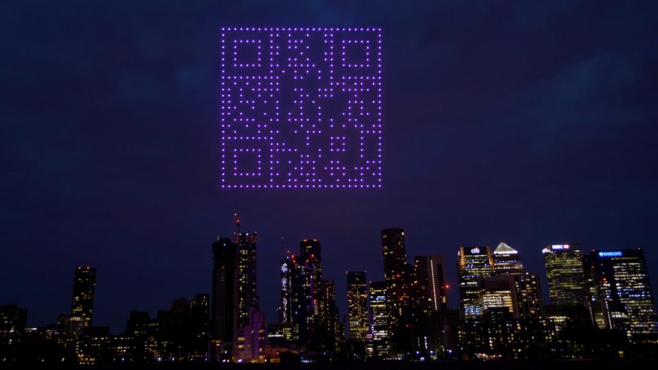 Drones form a QR code in the sky near London's Canary Wharf.