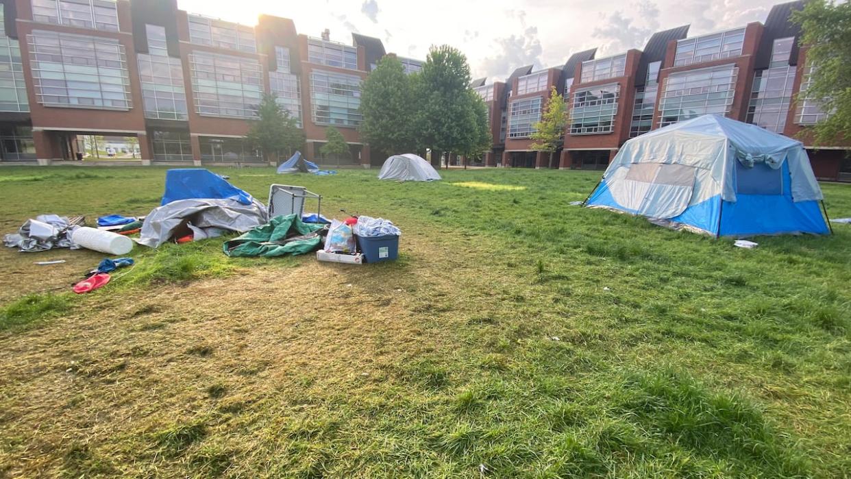 Students who participated in a protest encampment on the north Oshawa campus of Ontario Tech University began dismantling their tents Tuesday. (Paul Smith/CBC - image credit)