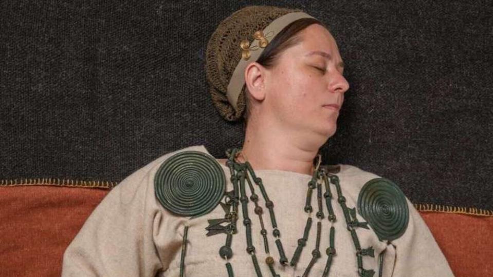 A woman wearing Bronze Age jewelry.