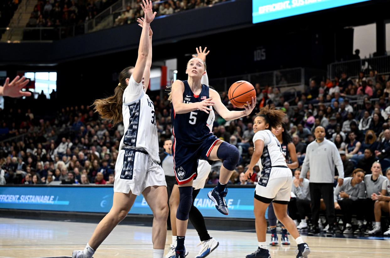 WASHINGTON, DC - JANUARY 07: Paige Bueckers #5 of the UConn Huskies drives to the basket against the Georgetown Hoyas at Entertainment & Sports Arena on January 07, 2024 in Washington, DC. (Photo by G Fiume/Getty Images)