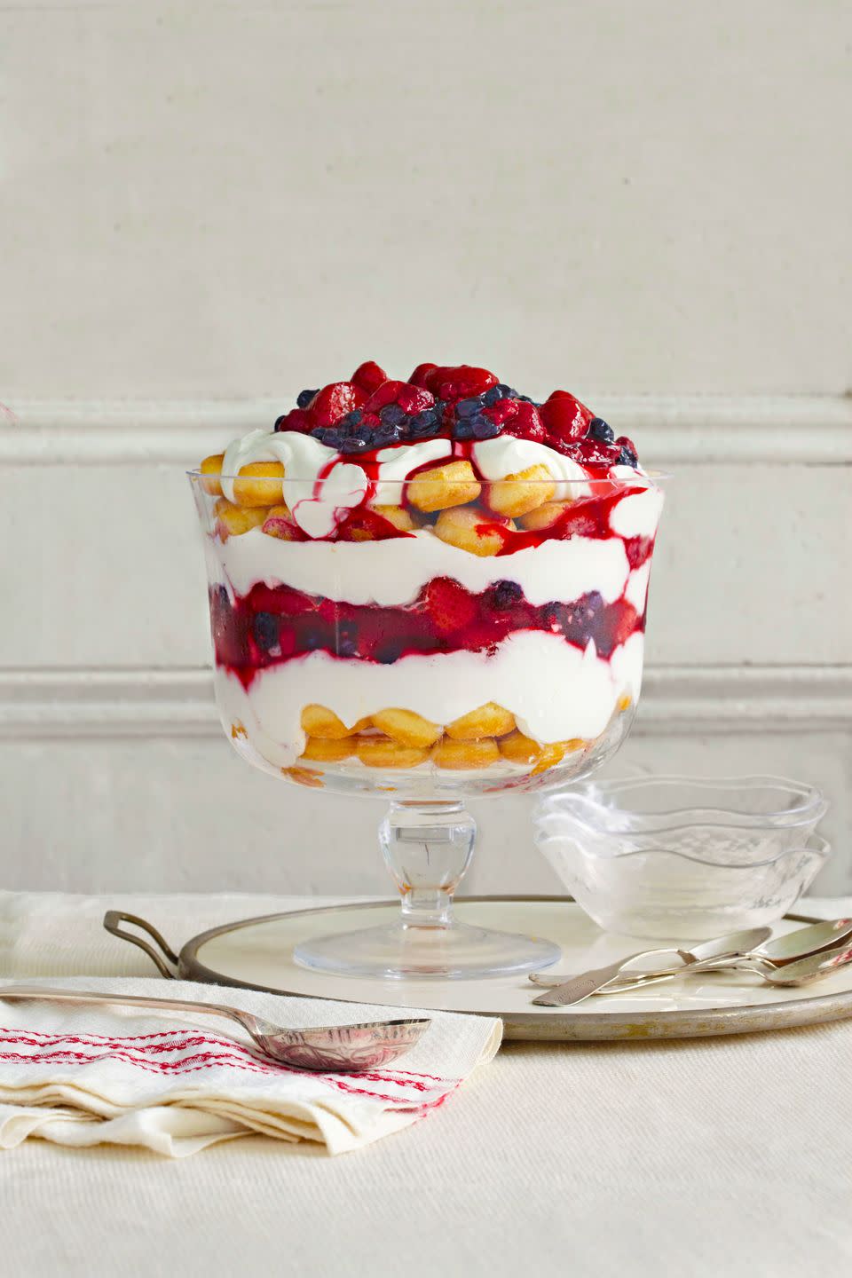 vanilla yogurt and berry trifle in a glass trifle dish