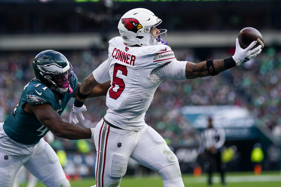 Arizona Cardinals running back James Conner (6) makes a one-handed touchdown catch in front of Philadelphia Eagles linebacker Nicholas Morrow during the second half of an NFL football game, Sunday, Dec. 31, 2023, in Philadelphia. (AP Photo/Matt Slocum)