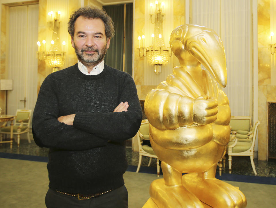 Moncler chairman Remo Ruffini poses after presenting its initial public offering for the admission of the company's shares to listing on the Milan's exchange market, in Milan, Italy, Monday, Dec. 2, 2013. Moncler, an Italian fashion house known for its down jackets, is launching an initial public offering this month in what Milan’s main stock exchange hopes will boost its plan to become an international hub for luxury goods company listings. (AP Photo/Antonio Calanni)