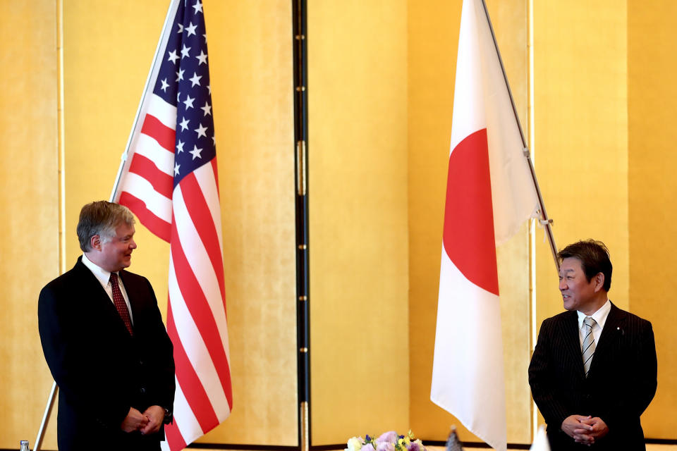 U.S. Deputy Secretary of State Stephen Biegun, left, and Japan's Foreign Minister Toshimitsu Motegi greet each other prior to their bilateral meeting in Tokyo Friday, July 10, 2020. (Behrouz Mehri/Pool Photo via AP)