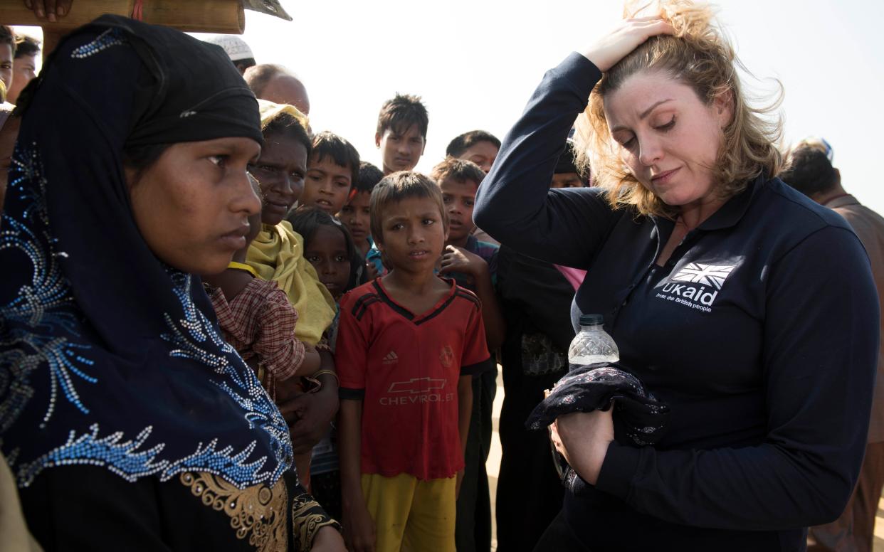 Secretary of State for International Development, Penny Mordaunt, listens to Yasmin 15, in Kutupalong refugee camp in Bangladesh  - Â©2017 Andrew Parsons / i-Images