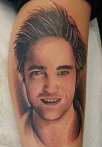 <p>Yes, it is a Robert Pattinson portrait. On someone's arm. In the form of a tattoo. What can we say, there really are some true 'Twihards' out there!<br><br><a rel="nofollow" href="http://au.thehype.yahoo.com/galleries/g/-/11345845/celebrity-ufo-enthusiasts/11345861/" data-ylk="slk:PICS: Celebrity UFO Enthusiasts;elm:context_link;itc:0;sec:content-canvas" class="link ">PICS: Celebrity UFO Enthusiasts</a></p>