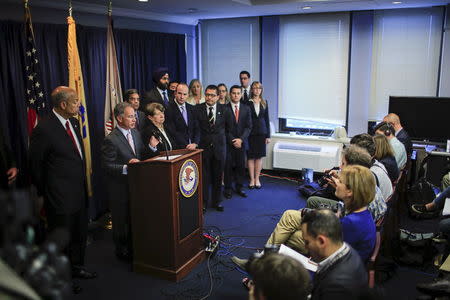 U.S. Attorney for New Jersey Paul J. Fishman (2nd L) speaks during a news conference in Newark, New Jersey August 11, 2015. REUTERS/Eduardo Munoz