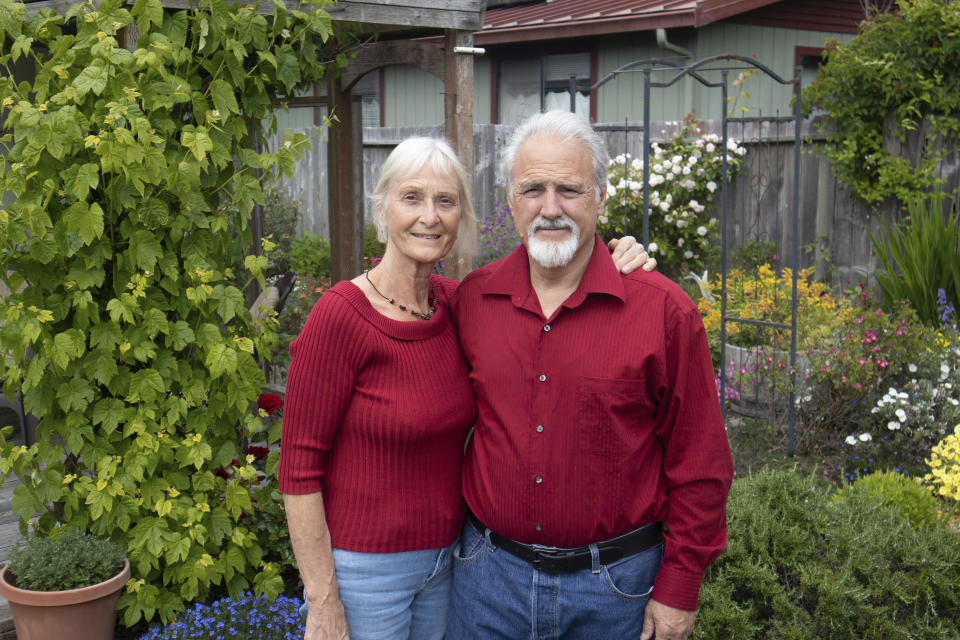 Jeff Woodke, and his wife, Els, pose for a photo at their home in McKinleyville, Calif., Monday, June 5, 2023. American missionary Jeff Woodke was taken by Islamic extremists in Niger and held in captivity for six-and-a-half years. Woodke and his wife, Els, recently spoke to The Associated Press in their first joint interview, sharing previously unreported details about his captivity and their frustrating interactions with the U.S government. (AP Photo/Shaun Walker)