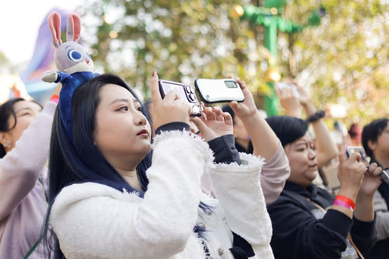 People attend the media preview tour of Disney World's first Zootopia-themed land attraction in Shanghai