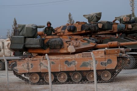 Turkish soldier is seen atop of a military vehicle in the border town of Akcakale in Sanliurfa province