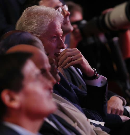 Bill Clinton watches the debate from the audience. Photo: EPA