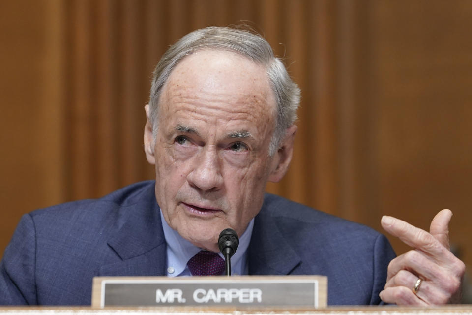Sen. Tom Carper, a Democrat from Delaware, is shown speaking into a microphone on Capitol Hill.