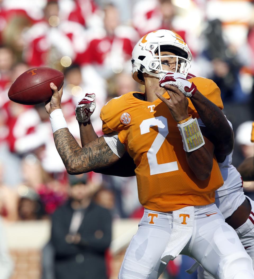 Tennessee quarterback Jarrett Guarantano (2) attempts to throw to a receiver as he is sacked by Alabama defensive back Xavier McKinney (15) in the first half of an NCAA college football game against Alabama Saturday, Oct. 20, 2018, in Knoxville, Tenn. (AP Photo/Wade Payne)