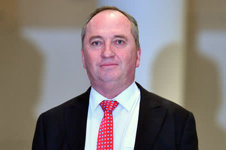 Former Australian deputy prime minister Barnaby Joyce, who was forced to resign last week amid public anger over an extramarital affair with his former press secretary with whom he is now expecting a child, arrives for a meeting of the country's National Party in Canberra, Australia February 26, 2018. AAP/Mick Tsikas/via REUTERS