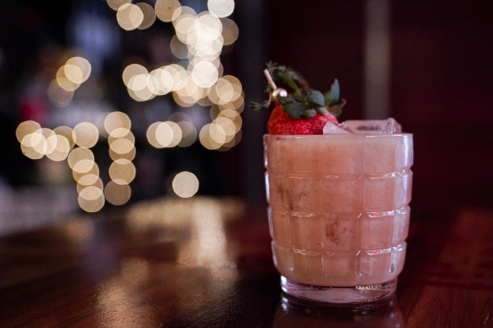 A mixed drink named "Peanut Butter Jelly Thyme," which contains whiskey distilled on premises, is seen on the cocktail lounge at Baltimore Spirits Company, Wednesday, Feb. 8, 2023, in Baltimore. Spirits have surpassed beer for U.S. market share supremacy, led by a resurgent cocktail culture — including the popularity of ready-to-drink concoctions, according to a spirits industry group. In 2022, spirits gained market share for the 13th straight year in the U.S. beverage alcohol market, with supplier sales reaching 42.1%, according to the Distilled Spirits Council of the United States. After years of steady growth, it marked the first time that spirits supplier revenues have surpassed beer, which holds a 41.9% market share, the group said. (AP Photo/Julio Cortez)