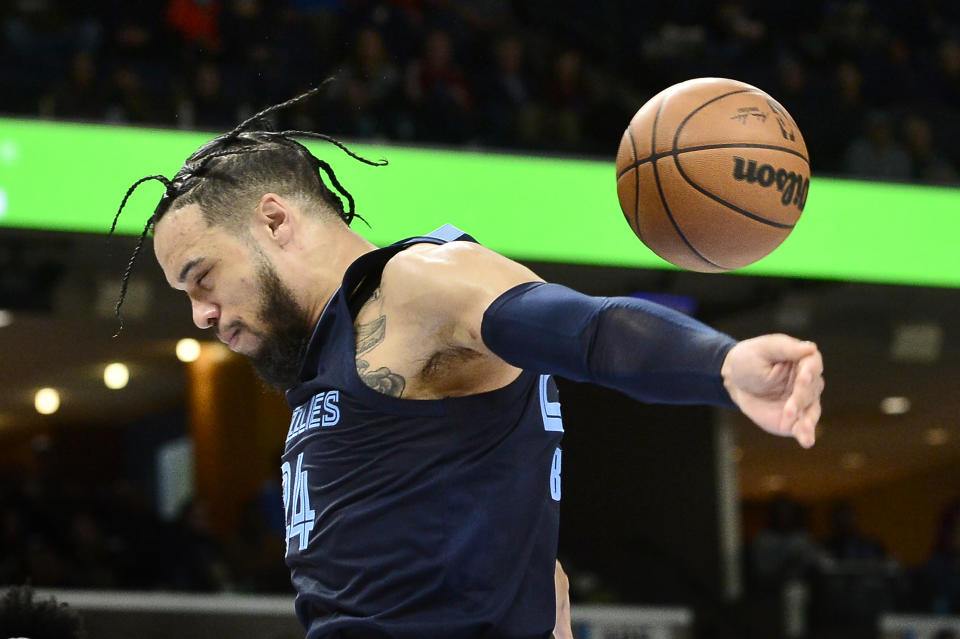 Memphis Grizzlies forward Dillon Brooks (24) finishes a dunk in the second half of an NBA basketball game against the Sacramento Kings Sunday, Nov. 28, 2021, in Memphis, Tenn. (AP Photo/Brandon Dill)