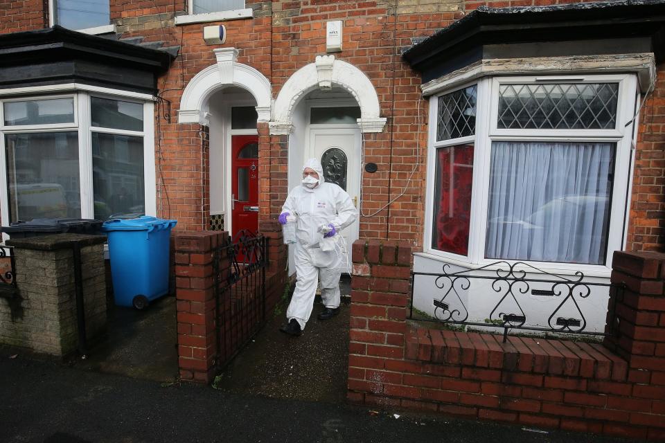 A forensic investigator at a house in Raglan Street, Hull (PA)