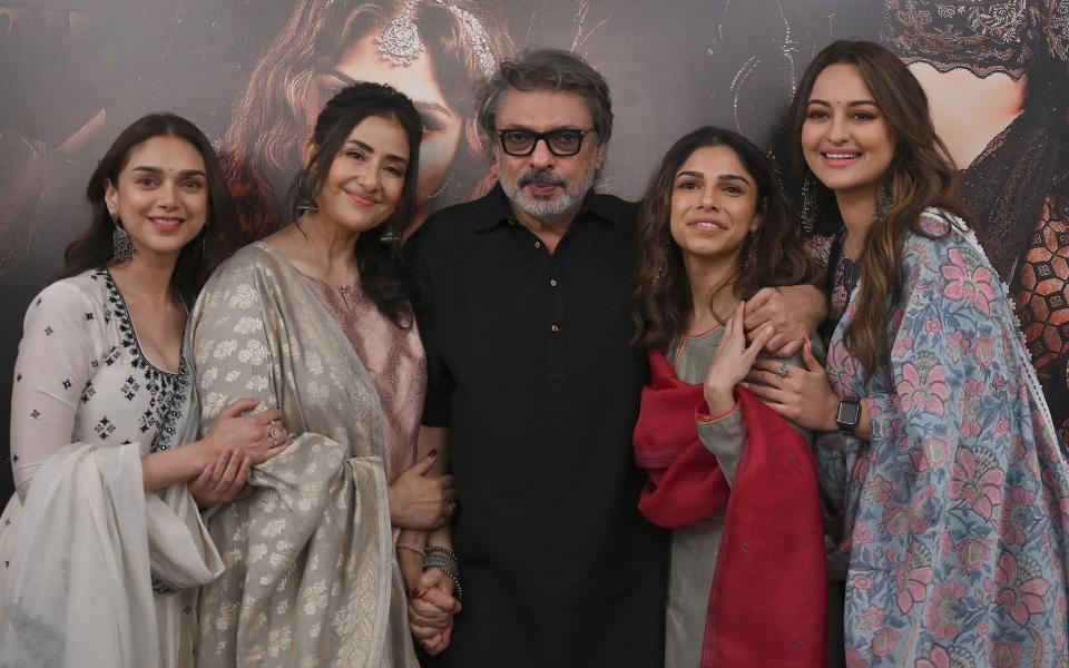 L-R: Aditi Rao Hydari, Manisha Koirala, director Sanjay Leela Bhansali, Sharmin Segal and Sonakshi Sinha pose during the promotion of their upcoming web series Heeramandi in Mumbai on February 18, 2023.