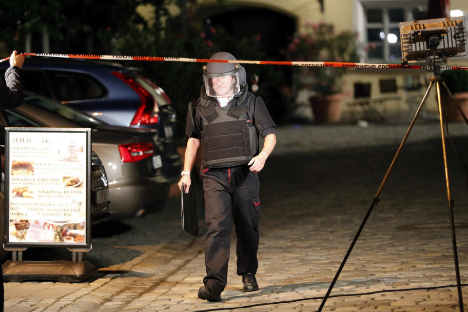 <p>A special police officer leaves the area where an explosion occurred in Ansbach, Germany, Monday, July 25, 2016. (AP Photo/Matthias Schrader)</p>