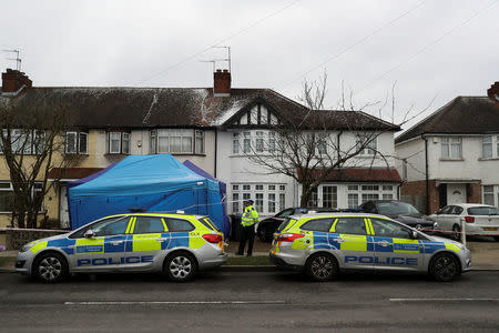 A police officer stands on duty outside the home of Nikolai Glushkov in New Malden, on the outskirts of London, Britain, March 17, 2018. REUTERS/Simon Dawson