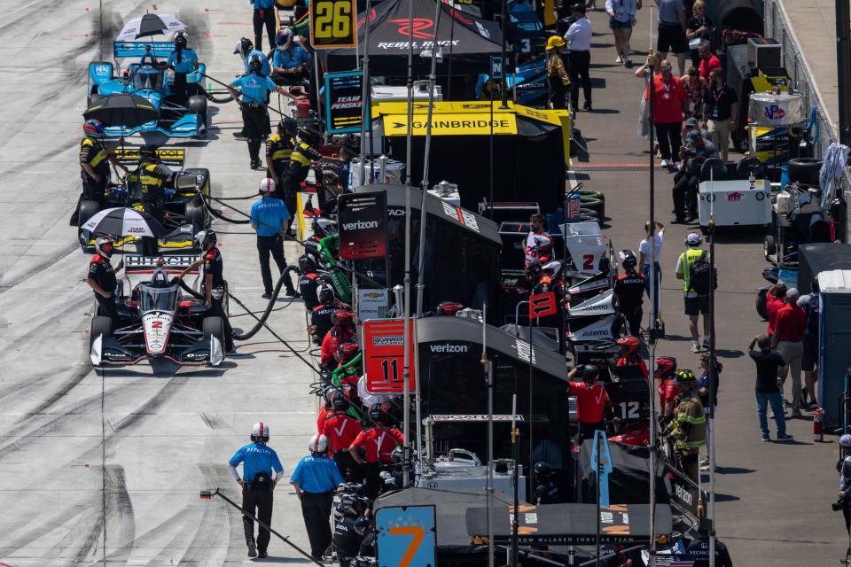 Drivers park for a pit stop during the Indy NXT by Firestone race one at the Detroit Grand Prix in downtown Detroit on Saturday, June 3, 2023. 