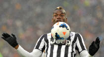 Juventus midfielder Paul Pogba, of France, controls the ball during a Serie A soccer match between Juventus and Bologna at the Juventus stadium, in Turin, Italy, Saturday, April 19, 2014. (AP Photo/Massimo Pinca)