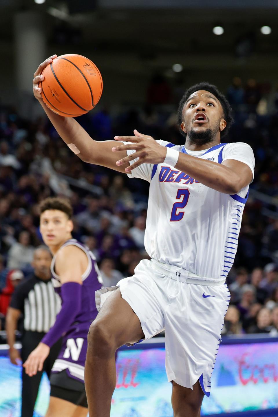 Dec 16, 2023; Chicago, Illinois, USA; DePaul Blue Demons guard Chico Carter Jr. (2) goes to the basket against the Northwestern Wildcats during the second half at Wintrust Arena. Mandatory Credit: Kamil Krzaczynski-USA TODAY Sports