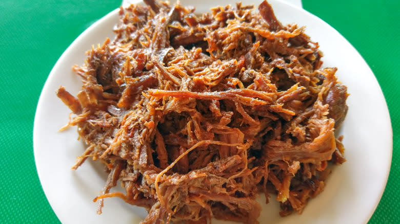 vaca frita against green background