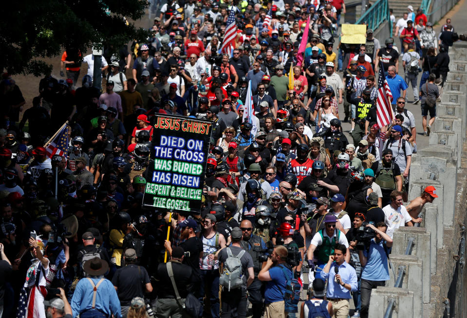 <p>Right-wing supporters of the Patriot Prayer group march during a rally in Portland, Ore., Aug. 4, 2018. (Photo: Jim Urquhart/Reuters) </p>