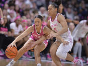 Penn State's Leilani Kapinus (5) attempts a steal on Iowa's Gabbie Marshall (24) during the first half of an NCAA college basketball game, Sunday, Feb. 5, 2023, in State College, Pa. (AP Photo/Gary M. Baranec)