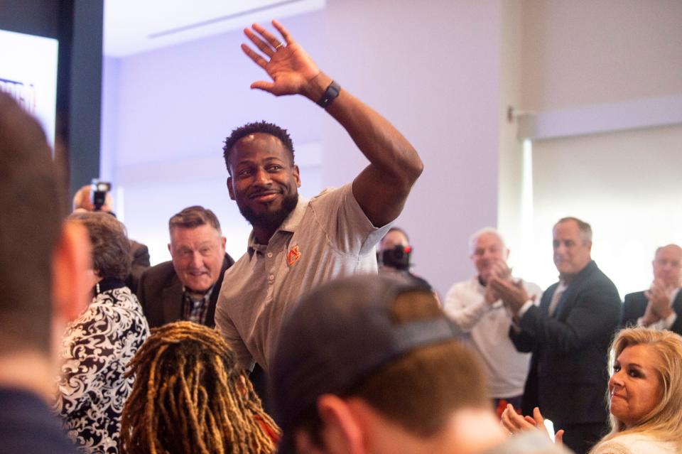 Auburn Tigers interim football coach Cadillac Williams is acknowledged during the introductory press conference for new head coach Hugh Freeze at the Woltosz Football Performance Center in Auburn, Ala., on Tuesday, Nov. 29, 2022