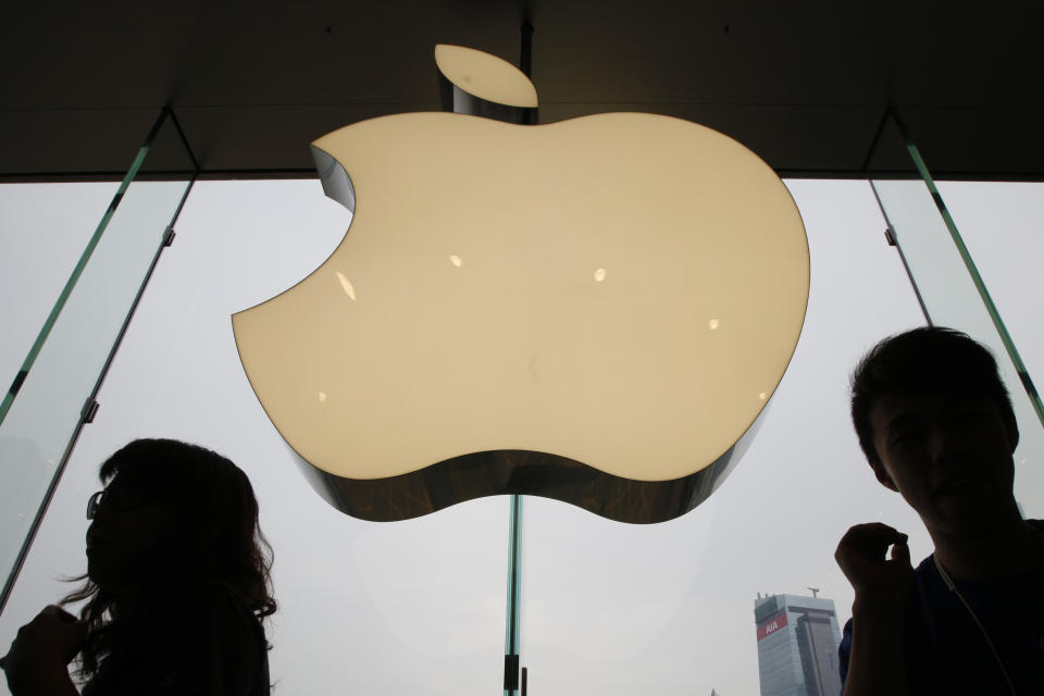 FILE - In this Sept. 24, 2011, file photo, an Apple logo is displayed at the Apple store in International Financial Center (IFC) shopping Mall, in Hong Kong. Under increased pressure from China, Apple has removed a police-tracking smartphone app used by Hong Kong protesters, cut off local access to a news app that extensively covered the anti-government protests and made it harder to find an emoji representing the Taiwanese national flag. (AP Photo/Kin Cheung, File)