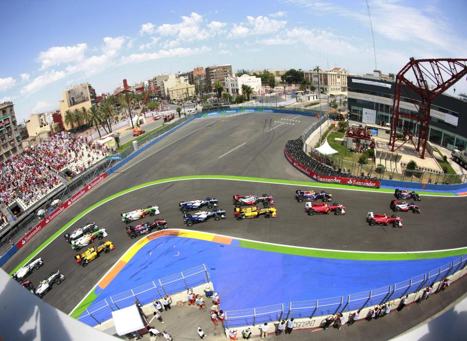 In this June 27, 2010, file photo, an aerial view shows the start of Europe's Formula One Grand Prix at the Valencia street circuit in Valencia, Spain. The start of the 2021 Formula One season has been delayed after the Australian Grand Prix was postponed because of the coronavirus pandemic. (AP Photo/Alberto Saiz,File)